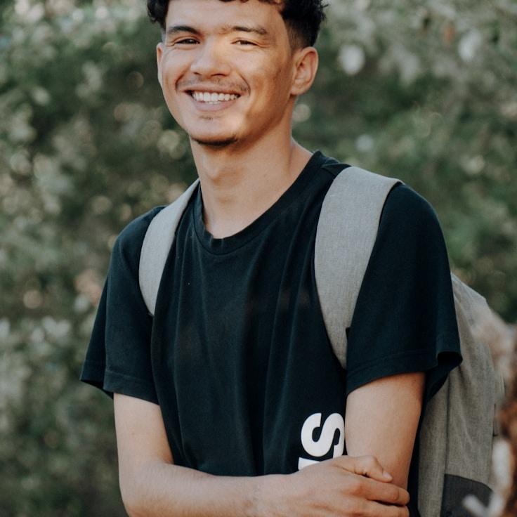 Kaveri Mehta, Lead Design Curator at SpectrumHarbor, reviewing corporate floral arrangements